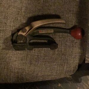 Green and Red Strapping Tool